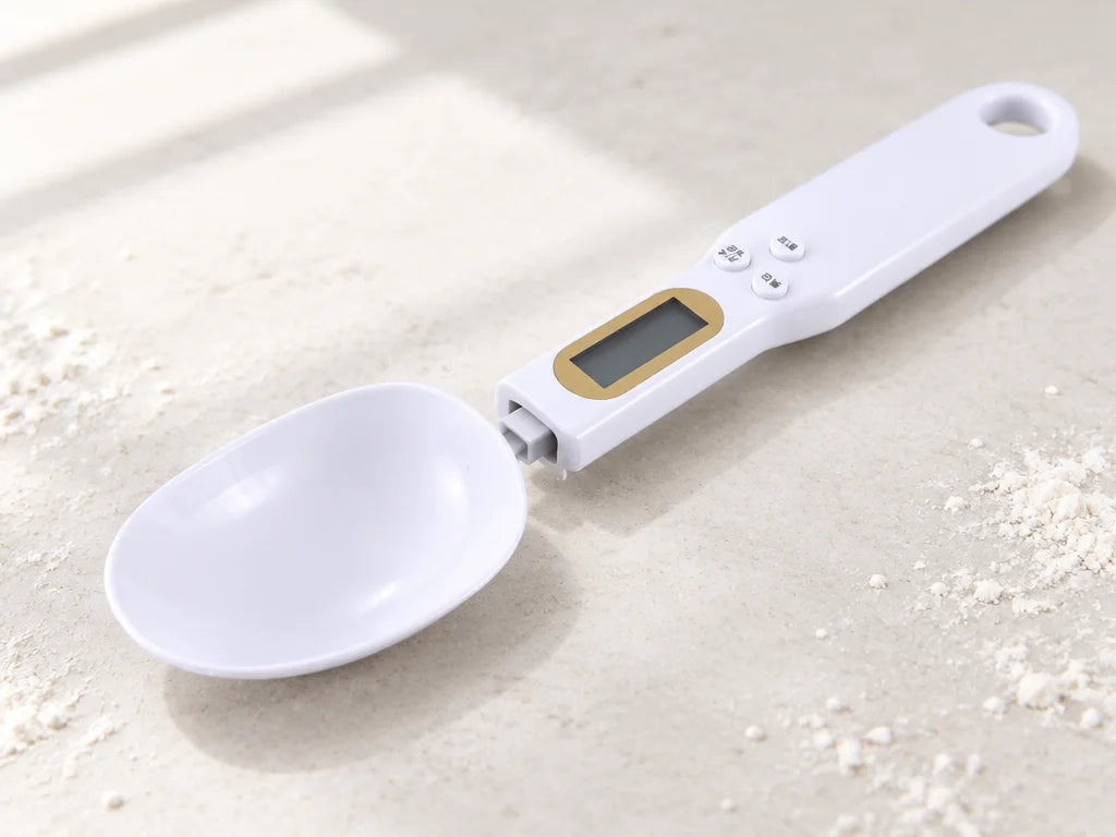 A close three-quarter product photograph showing the detachable oval spoon head and its real connect